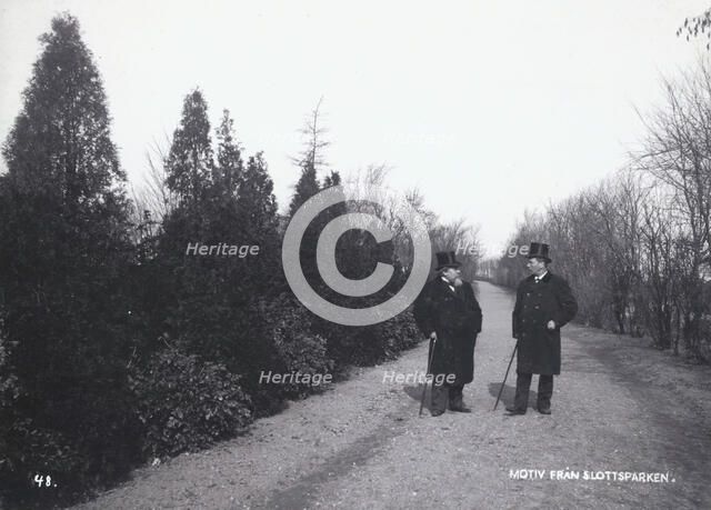 Two men walking in the Castle Park, Landskrona, Sweden, 1900.  Artist: Borg Mesch