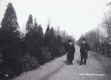 Two men walking in the Castle Park, Landskrona, Sweden, 1900. Creator: Borg Mesch