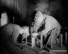 Two Men Working in a Factory, 1933. Creator: British Pathe Ltd