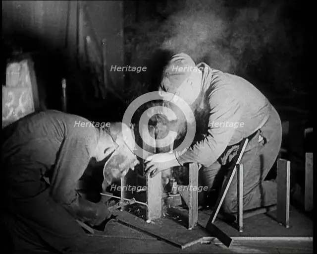 Two Men Working in a Factory, 1933. Creator: British Pathe Ltd.