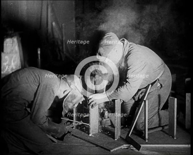 Two Men Working in a Factory, 1933. Creator: British Pathe Ltd.