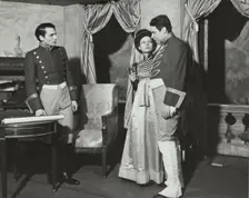 Two men and a woman, standing, 1938. Creator: Unknown