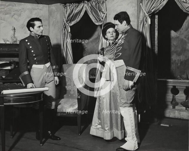 Two men and a woman, standing, 1938. Creator: Unknown.