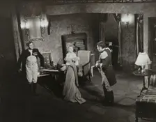 Two men and woman in evening dress, 1938. Creator: Unknown