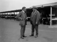 Two men chatting at Brooklands motor racing circuit, Surrey, 1920s. Artist: Bill Brunell