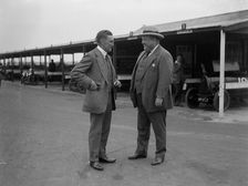 Two men chatting at Brooklands motor racing circuit, Surrey, 1920s. Artist: Bill Brunell