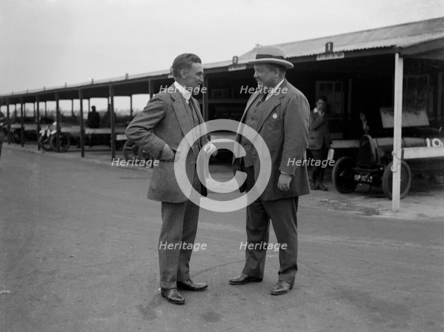 Two men chatting at Brooklands motor racing circuit, Surrey, 1920s. Artist: Bill Brunell.