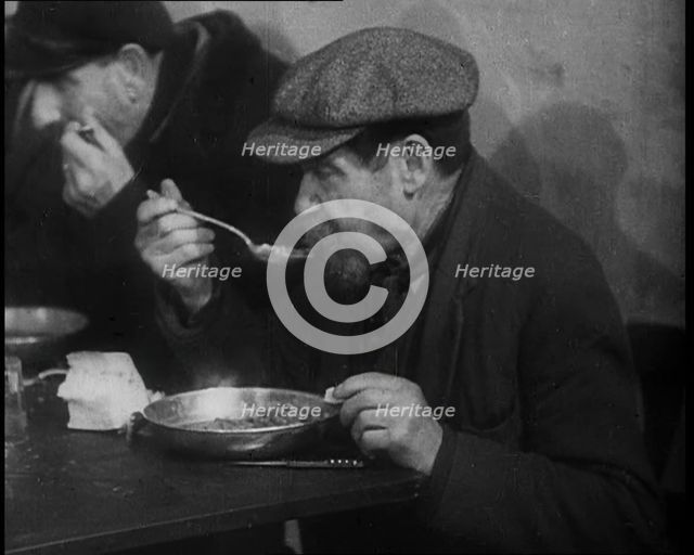 Two Men Eating Soup, 1933. Creator: British Pathe Ltd.