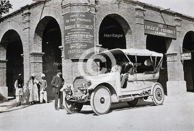 Two men in a car outside the Wellcome pharmaceutical depot in the Middle East, c1900s. Creator: Unknown.