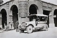 Two men in a car outside the Wellcome pharmaceutical depot in the Middle East, c1900s. Creator: Unknown