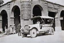 Two men in a car outside the Wellcome pharmaceutical depot in the Middle East, c1900s. Creator: Unknown