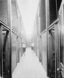 Two men in corridor, probably the Ypsilanti mineral bath house, Ypsilanti, Michigan, c1900-1910. Creator: Unknown