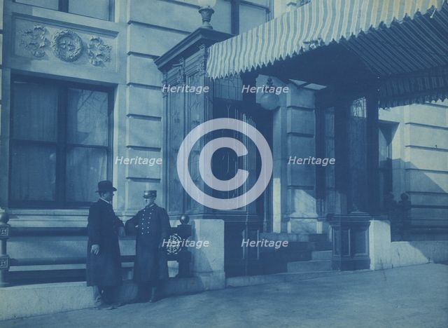 Two men, one a doorman, standing at the F. Street entrance to the Willard..., between 1901 and 1910. Creator: Frances Benjamin Johnston.