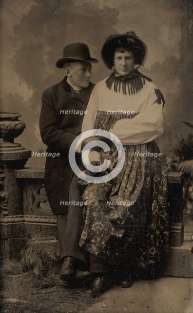 Two Men, One Dressed in Women's Attire, Holding Hands, 1870s-80s. Creator: Unknown.