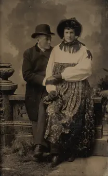 Two Men, One Dressed in Women's Attire, Holding Hands, 1870s-80s. Creator: Unknown