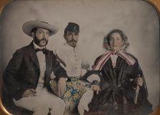 Two Men, One in Military Garb, and a Woman, Seated Around a Table, 1860s. Creator: Unknown
