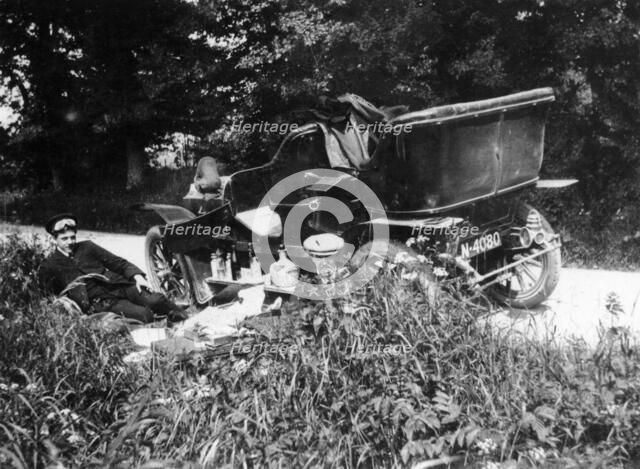 Two men picnicking beside a Vauxhall car, c1906. Artist: Unknown
