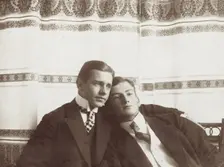 Two men resting close to one another, wearing formal attire, 1910. Creator: Unknown