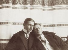 Two men resting close to one another, wearing formal attire, 1910. Creator: Unknown