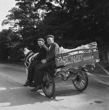 Two men seated on a horse and cart on a road, West Yorkshire, 1966-1974. Creator: Eileen Deste