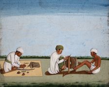 Two men sharpening a knife whilst the third prepares the blade on a sword, (between 1800 and 1899?). Creator: Unknown