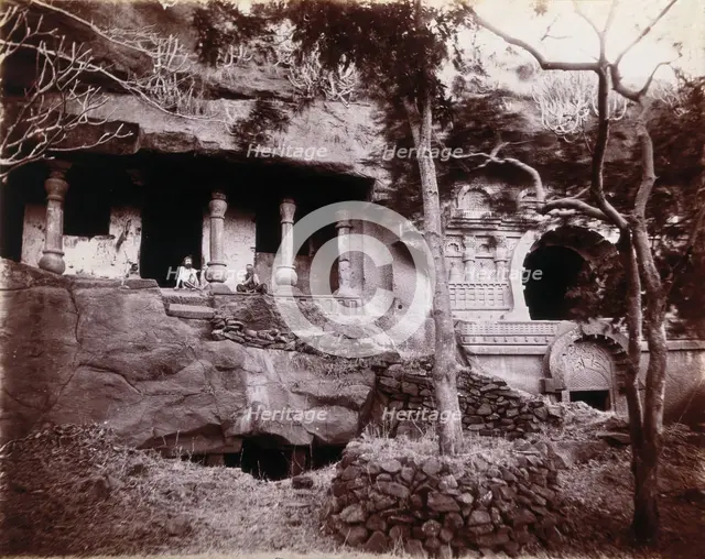 Two men sitting in a temple carved out of a rock face in Bombay at the time of the plague, 1896/1897 Creator: Unknown.