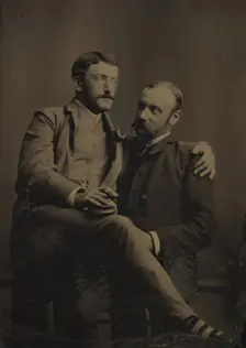 Two Men Smoking, One Seated in the Other's Lap, 1880s-90s. Creator: Unknown