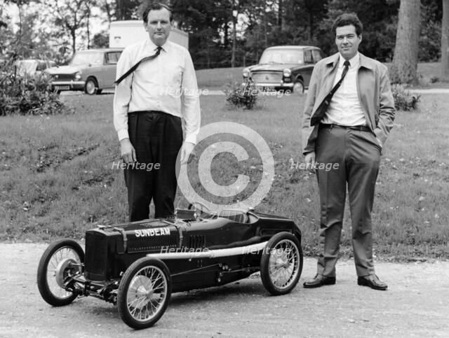 Two men standing by a miniature Sunbeam pedal car, 1960s. Artist: Unknown