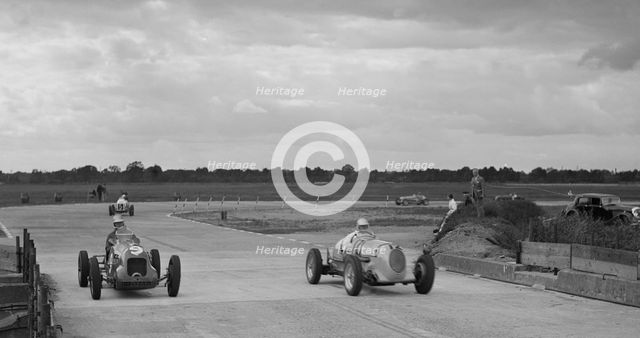 Two MGs racing at Brooklands, Surrey, c1930s. Artist: Bill Brunell.