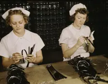 Two Navy wives, Eva Herzberg and Elve Burnham..., Glenview, Ill., 1942. Creator: Howard Hollem