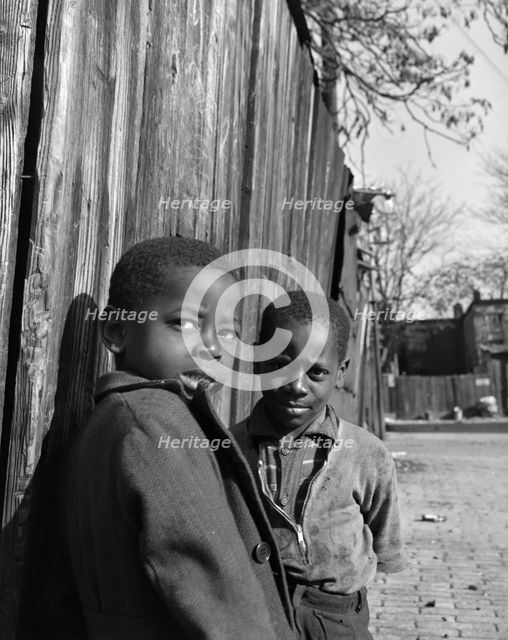 Two Negro boys, Washington (southwest section), D.C., 1942. Creator: Gordon Parks.
