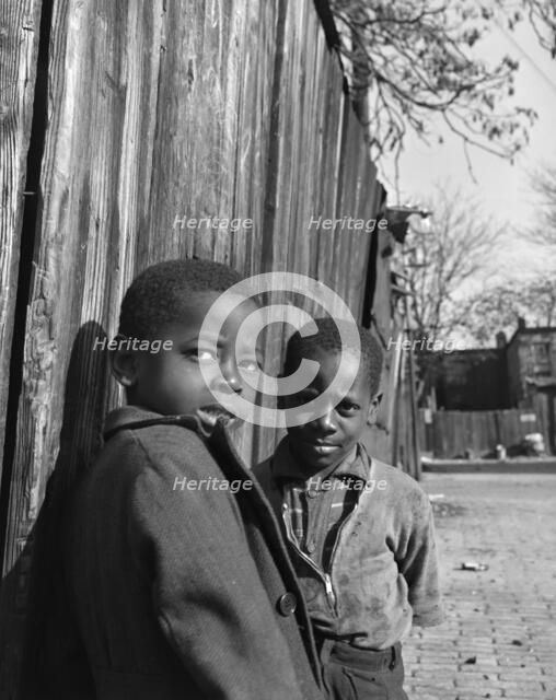 Two Negro boys, Washington (southwest section), D.C., 1942. Creator: Gordon Parks.
