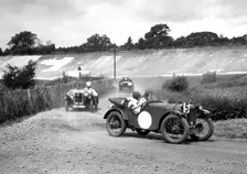 Two Austin Ulsters leading an MG, JCC Members Day, Brooklands, 4 July 1931. Artist: Bill Brunell