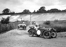 Two Austin Ulsters leading an MG, JCC Members Day, Brooklands, 4 July 1931. Artist: Bill Brunell