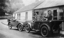 Two Austin Sevens parked outside a small tea shop, c1925