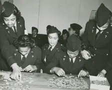 Two African American Lieutenants of the Women's Army Corps sitting at a table and..., 1939 - 1945. Creator: Unknown