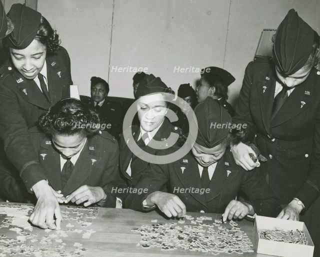 Two African American Lieutenants of the Women's Army Corps sitting at a table and..., 1939 - 1945. Creator: Unknown.