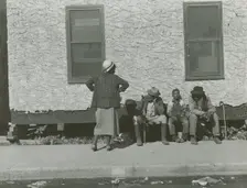 Two African American men and one African American boy sitting and one African..., Jan 1939. Creators: Farm Security Administration, Marion Post Wolcott