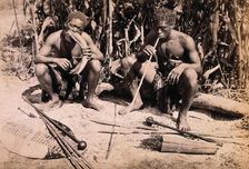 Two African men smoking pipes, 19th century. Creator: Unknown