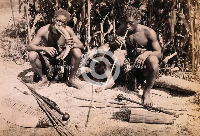 Two African men smoking pipes, 19th century. Creator: Unknown.
