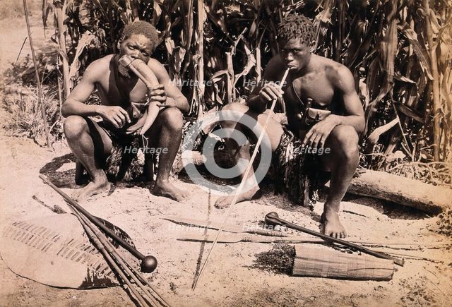 Two African men smoking pipes, 19th century. Creator: Unknown.