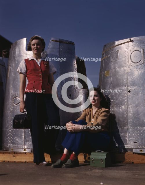 Two assembly line workers at the Long Beach, Calif., plant of Douglas Aircraft Company..., 1942. Creator: Alfred T Palmer.
