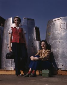 Two assembly line workers at the Long Beach, Calif., plant of Douglas Aircraft Company..., 1942. Creator: Alfred T Palmer