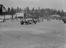 Two Bugatti Type 37s and an MG racing at Brooklands, Surrey, 1930s. Artist: Bill Brunell