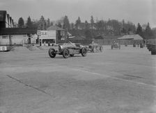 Two Bugatti Type 37s and an MG racing at Brooklands, Surrey, 1930s. Artist: Bill Brunell