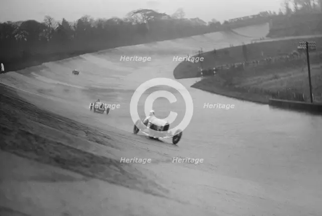 Two Bugattis racing at a BARC meeting, Brooklands, Surrey, 1931 Artist: Bill Brunell.
