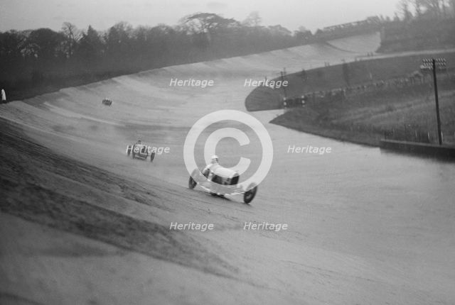 Two Bugattis racing at a BARC meeting, Brooklands, Surrey, 1931 Artist: Bill Brunell.