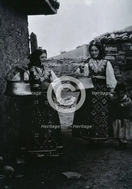 Two Bulgarian women with a child wearing national dress, c1900. Creator: Unknown.