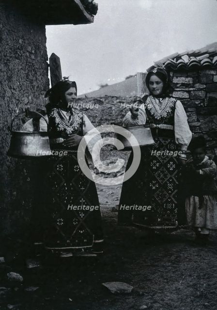 Two Bulgarian women with a child wearing national dress, c1900. Creator: Unknown.
