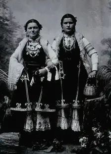Two Bulgarian women arm-in-arm wearing national dress, c1900. Creator: Unknown